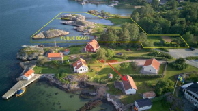 Holiday house with sea views and private beach on Tjorn